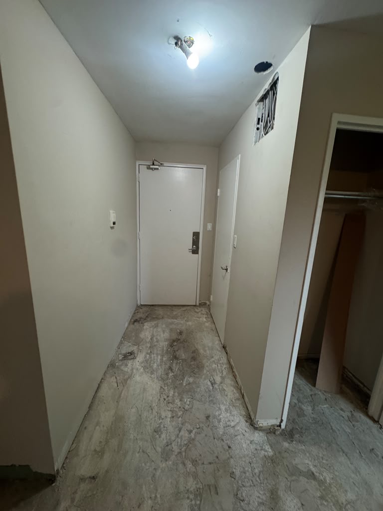 Entry hallway cleared and prepared for renovation